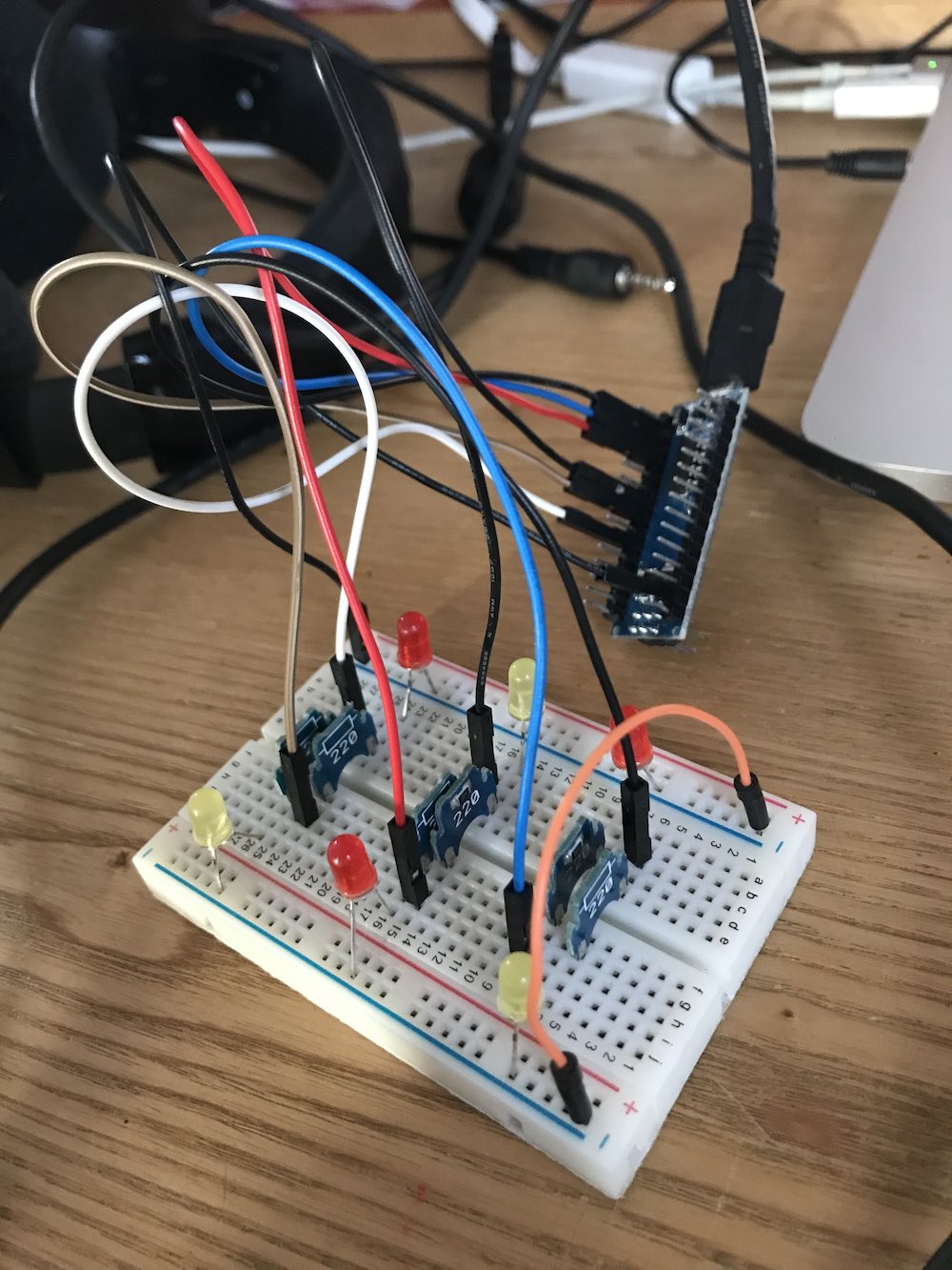 the breadboard, Arduino and LEDs described in the next paragraph